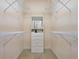 Spacious walk-in closet with custom shelving and built-in storage for optimal organization at 4240 Lake Harney Cir, Geneva, FL 32732