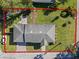Aerial view of the home showcasing the roof, lawn, and brick paved driveway at 4321 Summer Ln, Orlando, FL 32804