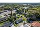 Aerial view of home with a green lawn, palm tree, and brick paved driveway and walkway at 4321 Summer Ln, Orlando, FL 32804