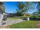 Relaxing backyard featuring a patio with outdoor seating and mature landscaping at 4321 Summer Ln, Orlando, FL 32804