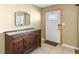 Entryway featuring tile flooring, a carved wood console table and a decorative mirror over a dark, carved wood console table at 4321 Summer Ln, Orlando, FL 32804