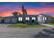 Charming single-story home featuring a well-manicured lawn, brick driveway and an attached two-car garage at 4321 Summer Ln, Orlando, FL 32804
