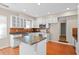 Charming kitchen with white cabinets, stainless steel microwave, and a cozy center island at 4321 Summer Ln, Orlando, FL 32804