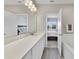 This bathroom offers double sinks, a wide mirror, tile floors, and a glass-enclosed shower at 4839 Jackstaff Way, Oviedo, FL 32765