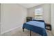 Guest bedroom with a queen bed, carpet floors, and a dresser at 4839 Jackstaff Way, Oviedo, FL 32765