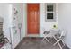 Close-up of front door and brick patio area with table and two chairs at 4839 Jackstaff Way, Oviedo, FL 32765