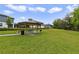 A spacious grassy area with a gazebo and picnic table, perfect for community gatherings at 4839 Jackstaff Way, Oviedo, FL 32765