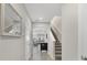 Hallway view with stairs, tile floors, and view of living room at 4839 Jackstaff Way, Oviedo, FL 32765