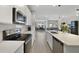 Kitchen with island, stainless appliances, white subway tile backsplash at 4839 Jackstaff Way, Oviedo, FL 32765