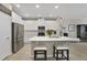 Kitchen with island, stainless appliances, and white cabinets at 4839 Jackstaff Way, Oviedo, FL 32765