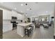Open-concept kitchen with island, stainless appliances, and open view to living room at 4839 Jackstaff Way, Oviedo, FL 32765