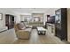 Living room featuring a large sectional sofa, tile floors, and a modern coffee table at 4839 Jackstaff Way, Oviedo, FL 32765