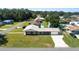 Aerial view showcases this charming home, nicely landscaped lawn, and proximity to the surrounding neighborhood at 5134 Harvard W St, Lakeland, FL 33810