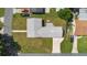 Aerial view of the home shows a new roof, spacious yard, and an extended driveway to the garage at 5134 Harvard W St, Lakeland, FL 33810