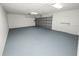Spacious two car garage with an automatic door, a side entry door, and bright lighting at 5134 Harvard W St, Lakeland, FL 33810