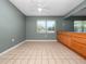 Bright kitchen nook with tile floors, window, ceiling fan, and wooden cabinets at 5134 Harvard W St, Lakeland, FL 33810