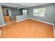 Living room with an open layout flowing into the kitchen and adjacent to a large window at 5134 Harvard W St, Lakeland, FL 33810