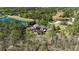 Gorgeous property featuring a pool, pond, detached structure, and private wooded setting at 5200 Carson St, St Cloud, FL 34771