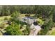 Stunning home with a screened-in pool, lush landscaping, and a circular driveway at 5200 Carson St, St Cloud, FL 34771