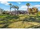 Spacious backyard featuring a large screened-in pool area with mature palm trees at 5200 Carson St, St Cloud, FL 34771