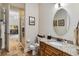 This bathroom features a single sink vanity and a walk-in shower at 5200 Carson St, St Cloud, FL 34771