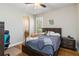 This bedroom has hardwood floors, neutral paint, and a door leading into the Primary bath at 5200 Carson St, St Cloud, FL 34771