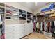 This walk-in closet features custom shelving and drawers at 5200 Carson St, St Cloud, FL 34771