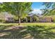 Charming stone-accented home with manicured lawn and mature landscaping at 5200 Carson St, St Cloud, FL 34771