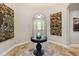 Elegant foyer features neutral paint, arched doorway, and decorative artwork at 5200 Carson St, St Cloud, FL 34771