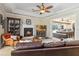 Inviting living room with a fireplace, tile floors, and views of the pool area at 5200 Carson St, St Cloud, FL 34771