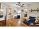 Open concept living room with multiple doorways and hardwood floors at 5200 Carson St, St Cloud, FL 34771