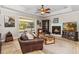 Cozy living room featuring a fireplace, tile floors, and comfortable seating at 5200 Carson St, St Cloud, FL 34771