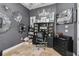 Home office space featuring gray walls, modern chandelier, and a stylish collection of wall art at 5200 Carson St, St Cloud, FL 34771