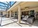 Large covered patio with access to the home's outdoor seating and grill areas at 5200 Carson St, St Cloud, FL 34771