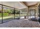 Covered patio overlooking a large grassy yard with mature trees at 5200 Carson St, St Cloud, FL 34771