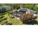 Gorgeous pool area with screened enclosure, solar panels, and mature palm trees at 5200 Carson St, St Cloud, FL 34771