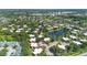 Expansive aerial view of a residential community with a lake, trees, and ample parking at 5334 Bamboo Ct # 463, Orlando, FL 32811