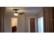 Bedroom showcases a ceiling fan, closet, and access to the bathroom at 5334 Bamboo Ct # 463, Orlando, FL 32811