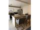 Kitchen featuring stainless steel appliances, breakfast bar and tile flooring at 5334 Bamboo Ct # 463, Orlando, FL 32811