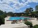 Enjoy the community pool with plenty of lounge chairs for relaxing in the sun at 5334 Bamboo Ct # 463, Orlando, FL 32811