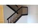 View of staircase with modern black railing and tile risers at 5334 Bamboo Ct # 463, Orlando, FL 32811