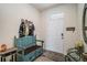 Cozy entryway with a bench, coat rack, and decorative touches at 5367 Pinecone Ct, Wildwood, FL 34785