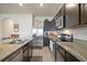 Updated kitchen featuring granite countertops and stainless steel appliances at 5367 Pinecone Ct, Wildwood, FL 34785