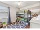 Charming bedroom with bunk beds, hardwood floors, and ample storage at 5441 Justine Way, Winter Park, FL 32792