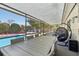 Spacious covered patio with pool access and outdoor dining area at 5441 Justine Way, Winter Park, FL 32792