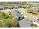 An aerial view of a multi-Gathering home in a neighborhood with a lake and lush greenery at 5565 Gelato Dr, Orlando, FL 32829