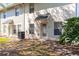 Backyard of home featuring lush landscaping and air conditioning at 5565 Gelato Dr, Orlando, FL 32829