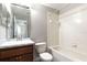 Bathroom features a vanity with a marble countertop and a shower and tub combination at 5565 Gelato Dr, Orlando, FL 32829