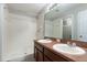 Bathroom with double sinks, modern fixtures, and shower at 5565 Gelato Dr, Orlando, FL 32829