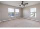 Bright bedroom with three windows that provide great natural light and views at 5565 Gelato Dr, Orlando, FL 32829
